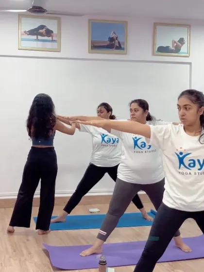 A little progress each day adds up to big results. Here, I'm helping a student find more length and correct alignment in Virabhadrasana II (Warrior II).