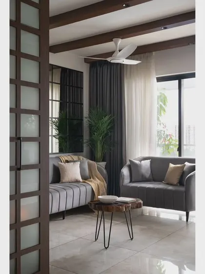 For the 'Nordic Grey Apartment', I used a monochrome palette and clean lines. Ceiling rafters and a large gridded mirror create an illusion of height and space in this compact living room.