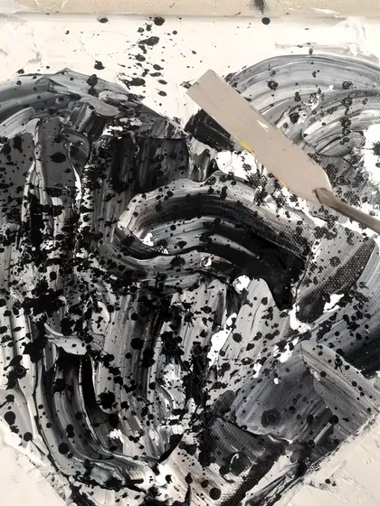 A textured, abstract heart painting in black and white, created with a palette knife. This piece explores the shades of grey in life and taking radical responsibility for our experiences.