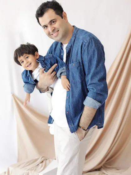 Twinning in denim! A playful and happy portrait of a father and his son, capturing a moment of pure fun and connection.