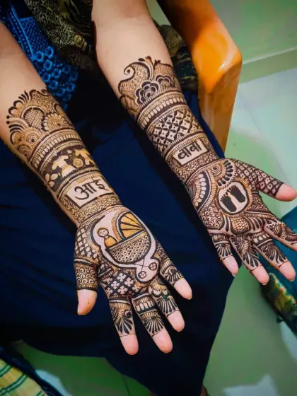 A slightly different angle of the "Aai-Baba" baby shower design, showing the full forearm coverage and intricate fill patterns.