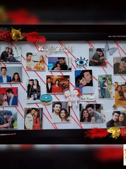 A handmade frame celebrating the on-screen couple 'Rajneetii', from the show Parineetii. The frame is decorated with red and yellow flowers, feathers, and other small embellishments.