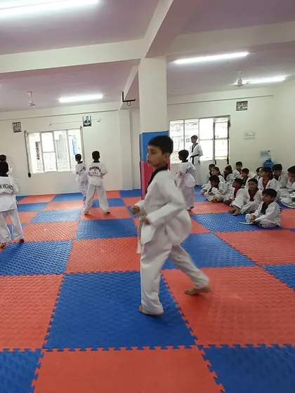 Students practicing their forms in the spacious Banaswadi dojang.