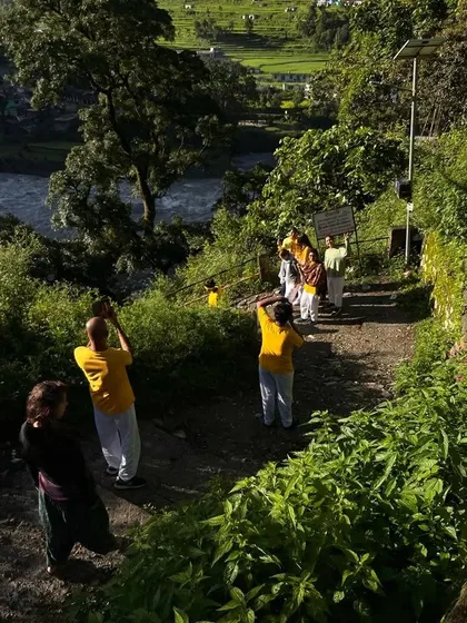 A group of students taking in the natural beauty during our teacher training course. We always make time to appreciate the environment that holds and supports our practice.