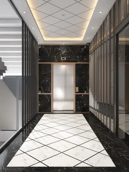 The elevator lobby design, featuring dramatic black marble walls contrasted with a geometric white marble floor inlay. This creates a powerful and luxurious transition space between floors.