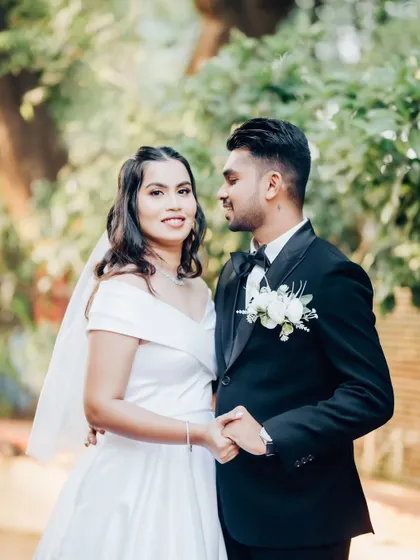 A classic couple's portrait. The bride's simple elegance and the groom's dapper suit make for a timeless photo.