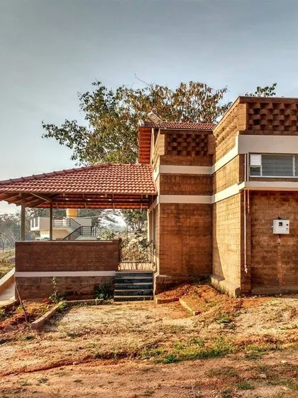 This is a real-world example of my principles in action. The building uses compressed stabilized earth blocks (CSEB) and a Mangalore tile roof, materials local to the region. This approach, known as vernacular architecture, reduces environmental impact and creates structures that are naturally suited to the climate.