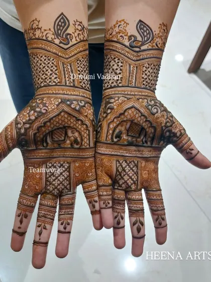 A lovely design for a family member, featuring traditional elephant and peacock motifs. My team and I ensure everyone feels part of the celebration.