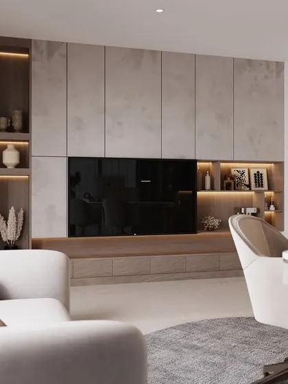 This view shows a combined living and working space. The entertainment wall features a mix of textured grey panels and wood shelving with integrated lighting, creating a sophisticated backdrop that is both beautiful and practical.