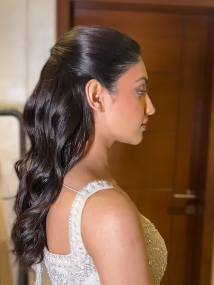 A profile shot of the finished look, showcasing the beautiful, uniform waves.