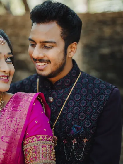 A close-up of the couple, showing the groom's admiration and the bride's happy glow.