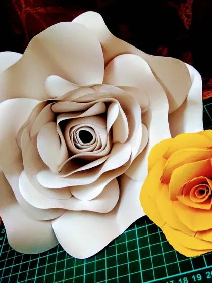 Another look at the handmade paper roses. The large white one and smaller yellow one are practice pieces, showing the different sizes I can create.