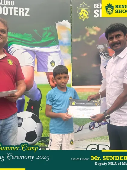 Another young player proudly receives his certificate from our esteemed Chief Guest, Mr. Sunder Raj.