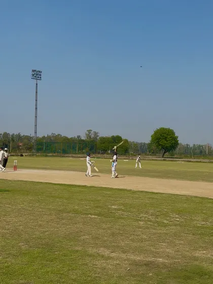 A powerful shot from Captain Aditi during her match-winning innings.