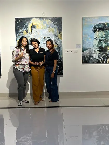 We love it when our guests feel at home. Here, visitors pose with some of the portraits from the "Legends of Our Time" exhibition, becoming part of the gallery's story for the evening.
