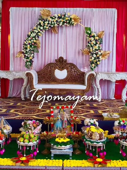 A minimal yet beautiful engagement setup, proving that love is the main highlight. The simple floral arch and small plate arrangement created an intimate and charming setting.