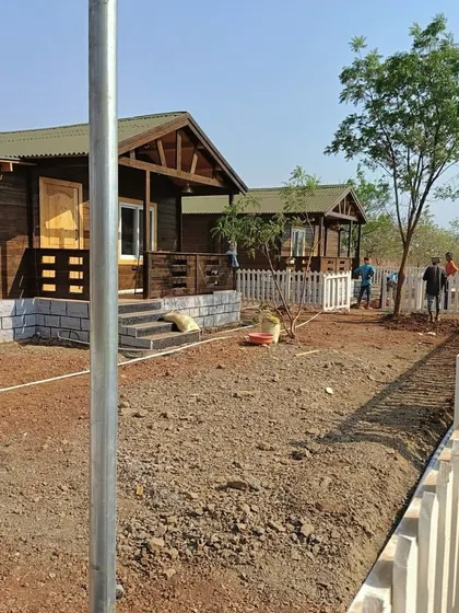 Work underway at the farmhouse site, with the ground leveled and ready for the next stage of landscaping.