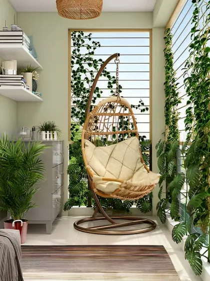 Here, I used climbing plants on a trellis to create a natural privacy screen. Paired with a comfortable swing chair, this design turns the balcony into a secluded and leafy retreat.
