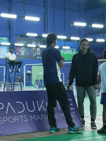 A coach speaks with young players courtside, providing strategy and encouragement. Our events are a complete ecosystem of competition and learning.