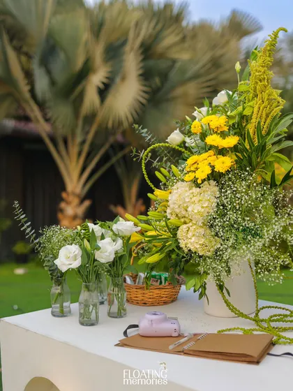 We set up a 'Polaroid Corner' where guests could snap a photo and leave a message for the parents-to-be. The station was beautifully decorated with fresh flowers, tying into the overall garden party aesthetic.