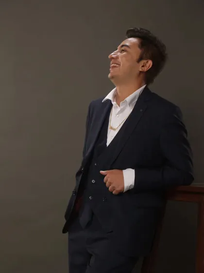 A happy, confident pose in a suit. I believe in looking sharp and bringing a positive, successful energy to your event.