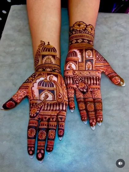 An example of my architectural style mehandi, with detailed palace windows (jharokhas) and peacocks, giving a royal Rajasthani feel.