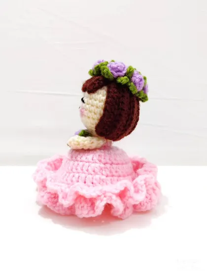 Another angle of the pink and purple flower doll.