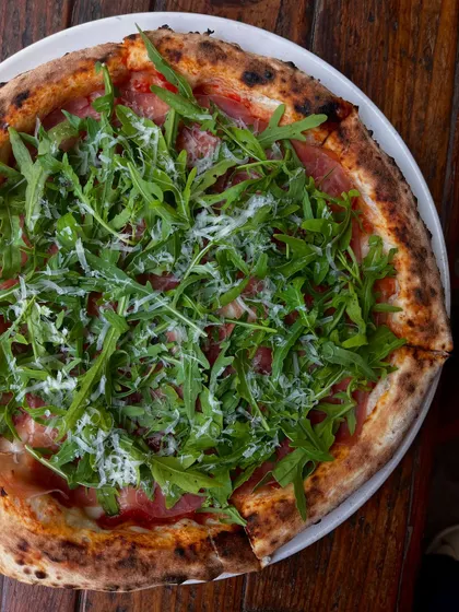 Our Prosciutto di Parma e Rucola pizza. The saltiness of the ham, the peppery arugula, and the fresh cheese make a perfect combination.