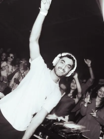 A black and white shot of me connecting with the crowd during a set. A smile and a hand in the air, it’s all about sharing the good vibes.