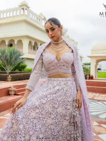 An ode to grace and grandeur. This pastel lilac lehenga from the 'Ruvaah' collection is adorned with exquisite 3D floral embroidery and delicate mirror work.