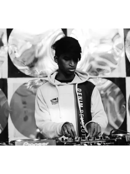 A black and white shot of me working the controls, with a unique, reflective background creating interesting patterns.