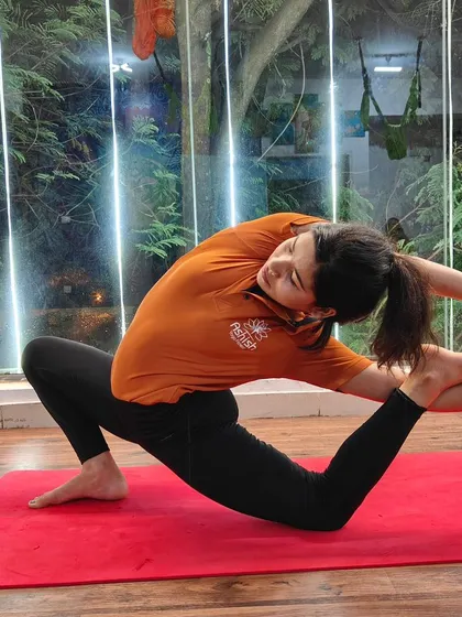 A variation of the pigeon pose, this deep stretch targets the quadriceps and hip flexors.