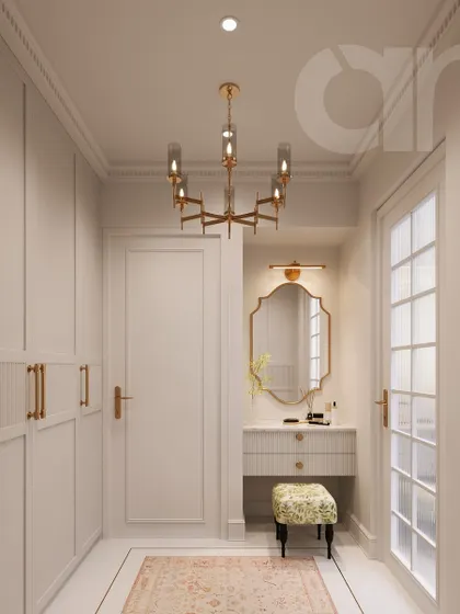 This walk-in closet is a study in understated luxury. I used clean lines, a muted color palette, and fluted textures on the wardrobes, accented with gilded hardware. The result is a chic and highly functional space where elegance is in the details.