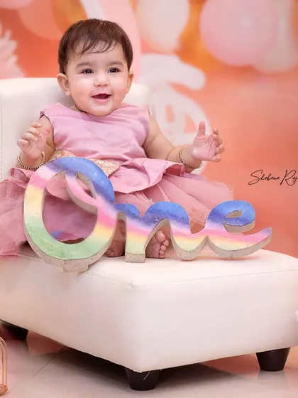 Posing like a pro for her first birthday. These milestone sessions are designed to be fun and comfortable, whether at my home studio or during a home visit.