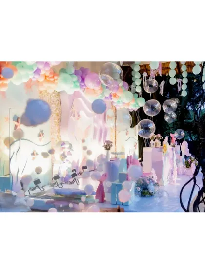 A dreamy, illuminated underwater scene. This setup uses creative lighting and hanging props to create the feeling of being in a magical ocean world.