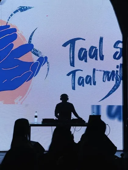 A silhouette of me against my custom 'Taal se Taal mila' visuals. This shot perfectly captures my philosophy: mixing beats and visuals to get everyone in sync on the dancefloor.
