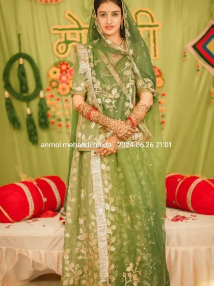 A classic, elegant pose of the bride at her mehendi ceremony, looking regal and ready for her big day.