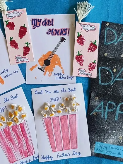 "My Dad Rocks!" Father's Day cards made with love, using handprints, fingerprints, and even popcorn.