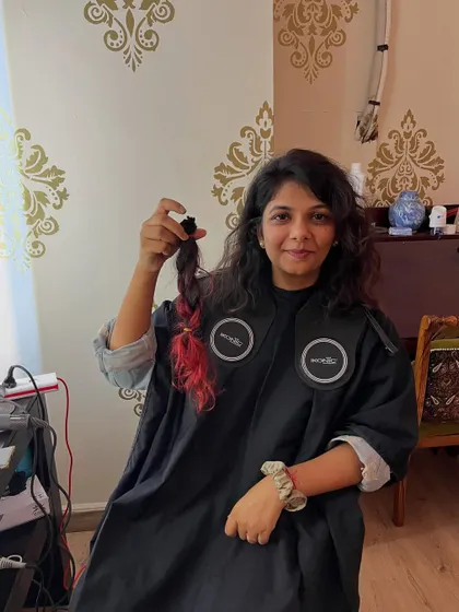 When you're tired of long, colored hair, donating it is a great option. Here's the ponytail, ready to be sent off.