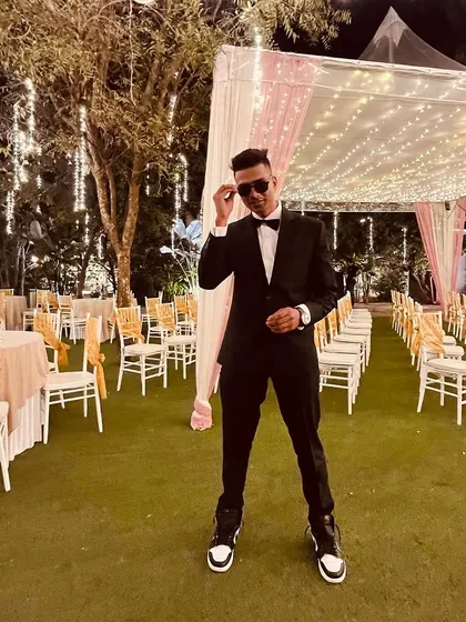 Another shot in the suit, ready for a classy gig. Sometimes the dress code is black tie, but the energy is always 100%.