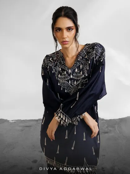 The Orion Kaftan Set in a deep navy blue, offering a dramatic and sophisticated alternative. The silver embellishments stand out beautifully against the dark fabric.