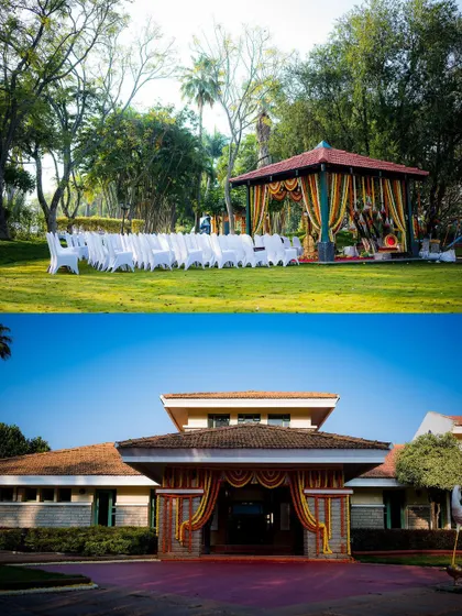 A wide view of the outdoor wedding venue, showing the beautiful lawn, the house, and the mandap.