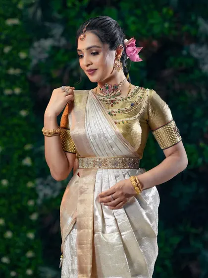 A close-up showing the delicate makeup and jewelry that perfectly accessorize the outfit.