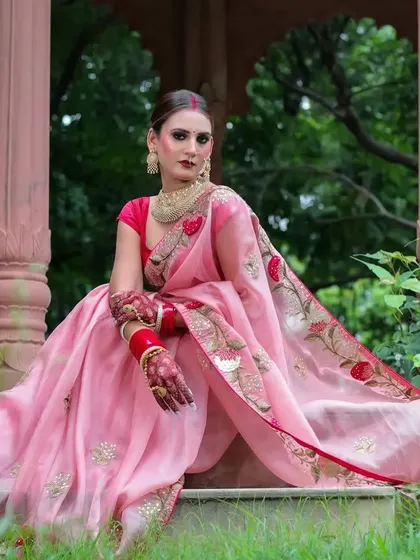 Another beautiful seated portrait in the gazebo, this time with a focus on the intricate floral embroidery along the saree's border.