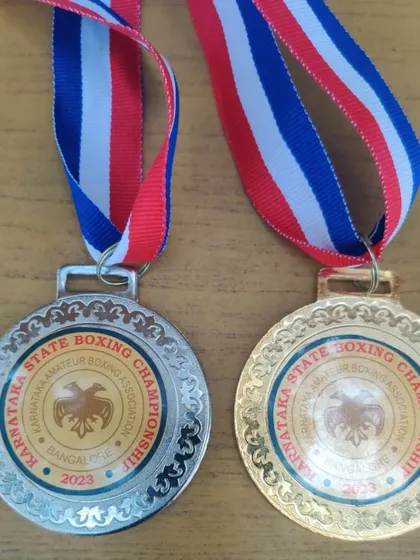 A close-up of the state championship medals. These represent the high level of competition our fighters face and conquer.