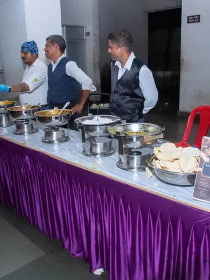 My staff serving at a corporate lunch. You can see my branding on the table, which adds a professional touch.