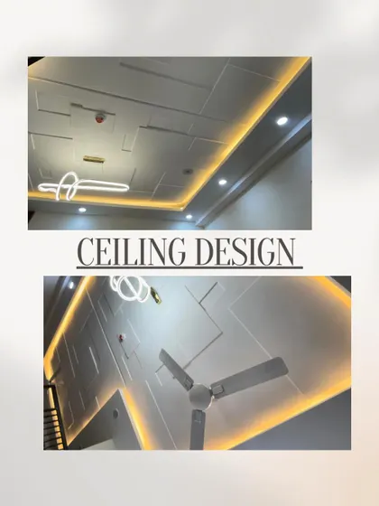A modern geometric ceiling design with recessed rectangular patterns and warm cove lighting. This style adds depth and a contemporary feel to the room.