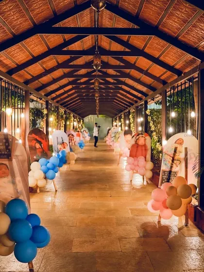 A stunning walkway lined with photos of the birthday twins, creating a personalized journey for guests.