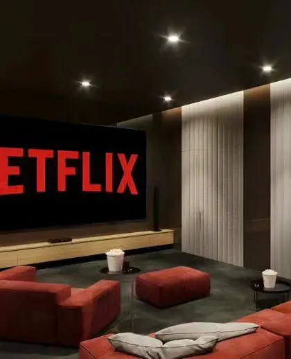A concept for a dedicated home theater room. The simple, low-profile modular console sits below a large screen, with wall paneling designed to enhance acoustics and create a cinematic feel.