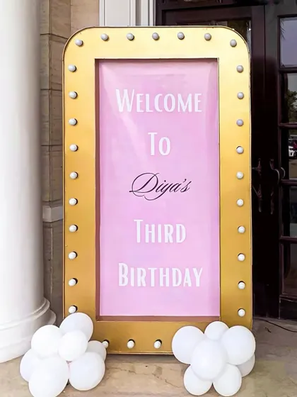 The stunning gold and pink marquee welcome sign for Diya's third birthday, setting a royal and celebratory tone for the princess party.
